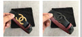 Chanel CC reversible belt showing gold and matte black buckle options